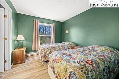 TURNKEY, SLOPESIDE condo overlooking Easy Street ski run and on Sugar Mountain Golf Course in North Carolina - for sale on GolfHomes.com, golf home, golf lot