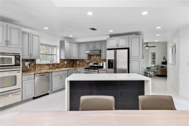 This elegant Spanish home filled with natural light, is situated on Granada Golf Club in Florida - for sale on GolfHomes.com, golf home, golf lot