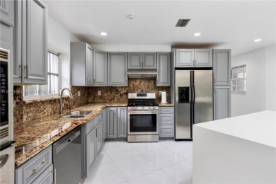 This elegant Spanish home filled with natural light, is situated on Granada Golf Club in Florida - for sale on GolfHomes.com, golf home, golf lot