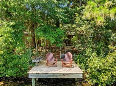 Southern coastal design and decor define this lakefront cottage on Sandestin Golf and Beach Resort - Raven in Florida - for sale on GolfHomes.com, golf home, golf lot