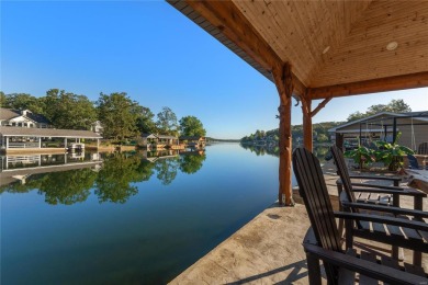 This 4-bedroom, 3-bathroom lake front Atrium Ranch home boasts on Raintree Country Club in Missouri - for sale on GolfHomes.com, golf home, golf lot