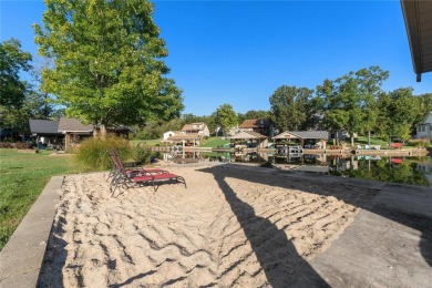 This 4-bedroom, 3-bathroom lake front Atrium Ranch home boasts on Raintree Country Club in Missouri - for sale on GolfHomes.com, golf home, golf lot