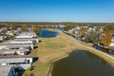 MOVE RIGHT INTO THIS BEAUTIFUL HOME WITH LVP THRU OUT, TRAY on Golden Lakes Golf Course in Florida - for sale on GolfHomes.com, golf home, golf lot