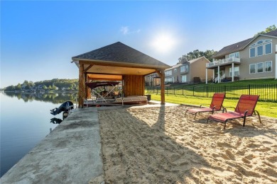 This 4-bedroom, 3-bathroom lake front Atrium Ranch home boasts on Raintree Country Club in Missouri - for sale on GolfHomes.com, golf home, golf lot