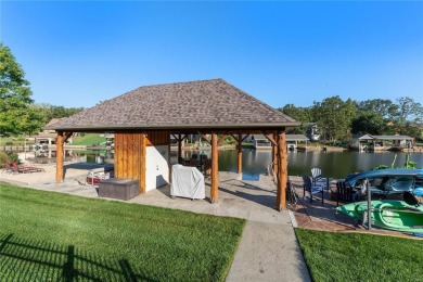 This 4-bedroom, 3-bathroom lake front Atrium Ranch home boasts on Raintree Country Club in Missouri - for sale on GolfHomes.com, golf home, golf lot