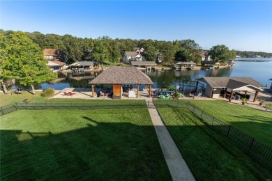 This 4-bedroom, 3-bathroom lake front Atrium Ranch home boasts on Raintree Country Club in Missouri - for sale on GolfHomes.com, golf home, golf lot