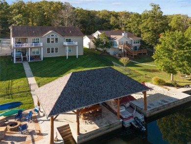 This 4-bedroom, 3-bathroom lake front Atrium Ranch home boasts on Raintree Country Club in Missouri - for sale on GolfHomes.com, golf home, golf lot