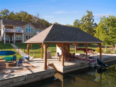 This 4-bedroom, 3-bathroom lake front Atrium Ranch home boasts on Raintree Country Club in Missouri - for sale on GolfHomes.com, golf home, golf lot