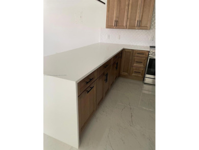 Experience luxurious living in this beautifully remodeled on Kings Point Golf - Executive in Florida - for sale on GolfHomes.com, golf home, golf lot