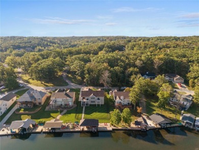 This 4-bedroom, 3-bathroom lake front Atrium Ranch home boasts on Raintree Country Club in Missouri - for sale on GolfHomes.com, golf home, golf lot