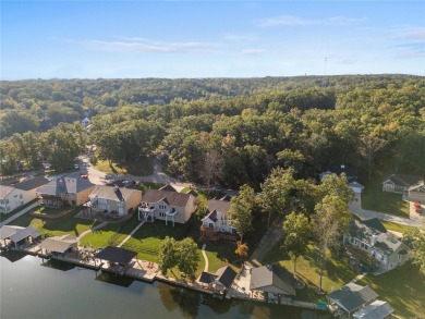 This 4-bedroom, 3-bathroom lake front Atrium Ranch home boasts on Raintree Country Club in Missouri - for sale on GolfHomes.com, golf home, golf lot