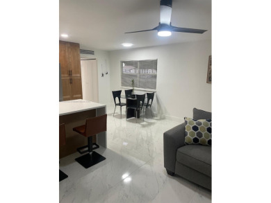 Experience luxurious living in this beautifully remodeled on Kings Point Golf - Executive in Florida - for sale on GolfHomes.com, golf home, golf lot