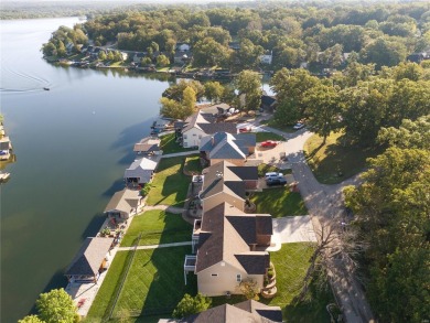 This 4-bedroom, 3-bathroom lake front Atrium Ranch home boasts on Raintree Country Club in Missouri - for sale on GolfHomes.com, golf home, golf lot