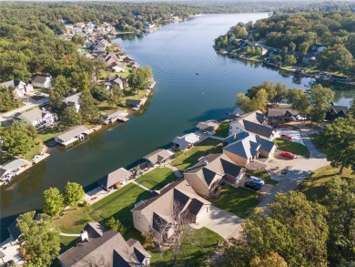 This 4-bedroom, 3-bathroom lake front Atrium Ranch home boasts on Raintree Country Club in Missouri - for sale on GolfHomes.com, golf home, golf lot