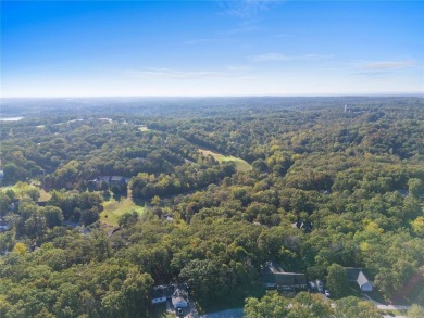 This 4-bedroom, 3-bathroom lake front Atrium Ranch home boasts on Raintree Country Club in Missouri - for sale on GolfHomes.com, golf home, golf lot