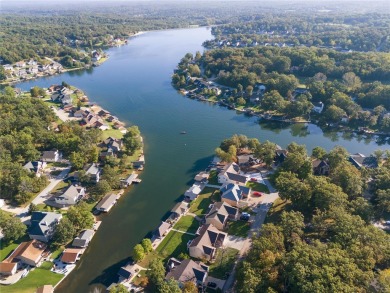 This 4-bedroom, 3-bathroom lake front Atrium Ranch home boasts on Raintree Country Club in Missouri - for sale on GolfHomes.com, golf home, golf lot