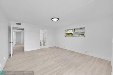This stunning corner unit features high-quality waterproof vinyl on Wynmoor Golf Course in Florida - for sale on GolfHomes.com, golf home, golf lot
