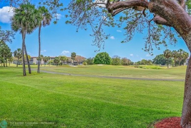 This stunning corner unit features high-quality waterproof vinyl on Wynmoor Golf Course in Florida - for sale on GolfHomes.com, golf home, golf lot