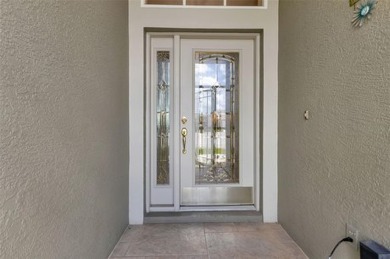 SENSATIONAL WATER VIEW from a MASSIVE enclosed and tiled lanai on Kings Gate Golf Club in Florida - for sale on GolfHomes.com, golf home, golf lot