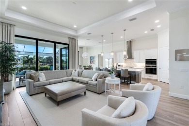 Sophisticated, serene, contemporary, and warm, this absolutely on The Golf Club At Fiddlers Creek in Florida - for sale on GolfHomes.com, golf home, golf lot