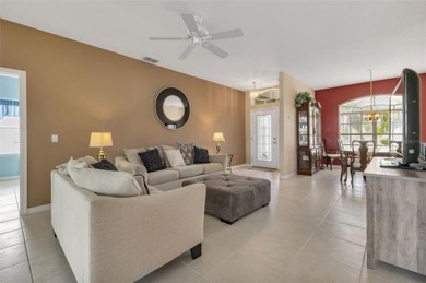 SENSATIONAL WATER VIEW from a MASSIVE enclosed and tiled lanai on Kings Gate Golf Club in Florida - for sale on GolfHomes.com, golf home, golf lot
