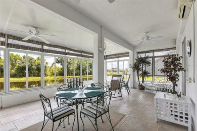 SENSATIONAL WATER VIEW from a MASSIVE enclosed and tiled lanai on Kings Gate Golf Club in Florida - for sale on GolfHomes.com, golf home, golf lot