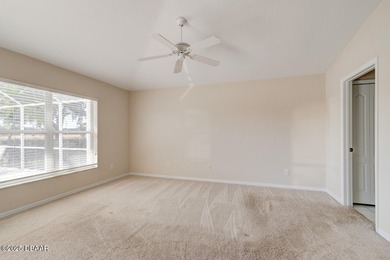 This stunning 3-bedroom plus den/office , 2-bath home is located on Spruce Creek Golf Club in Florida - for sale on GolfHomes.com, golf home, golf lot