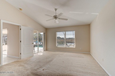 This stunning 3-bedroom plus den/office , 2-bath home is located on Spruce Creek Golf Club in Florida - for sale on GolfHomes.com, golf home, golf lot