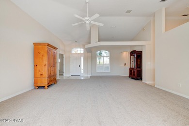 This stunning 3-bedroom plus den/office , 2-bath home is located on Spruce Creek Golf Club in Florida - for sale on GolfHomes.com, golf home, golf lot