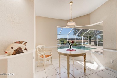 This stunning 3-bedroom plus den/office , 2-bath home is located on Spruce Creek Golf Club in Florida - for sale on GolfHomes.com, golf home, golf lot