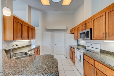 This stunning 3-bedroom plus den/office , 2-bath home is located on Spruce Creek Golf Club in Florida - for sale on GolfHomes.com, golf home, golf lot