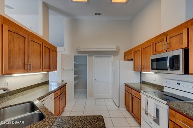 This stunning 3-bedroom plus den/office , 2-bath home is located on Spruce Creek Golf Club in Florida - for sale on GolfHomes.com, golf home, golf lot