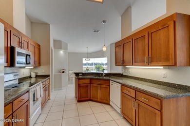 This stunning 3-bedroom plus den/office , 2-bath home is located on Spruce Creek Golf Club in Florida - for sale on GolfHomes.com, golf home, golf lot