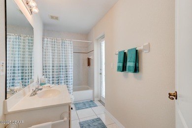 This stunning 3-bedroom plus den/office , 2-bath home is located on Spruce Creek Golf Club in Florida - for sale on GolfHomes.com, golf home, golf lot