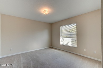 This stunning 3-bedroom plus den/office , 2-bath home is located on Spruce Creek Golf Club in Florida - for sale on GolfHomes.com, golf home, golf lot