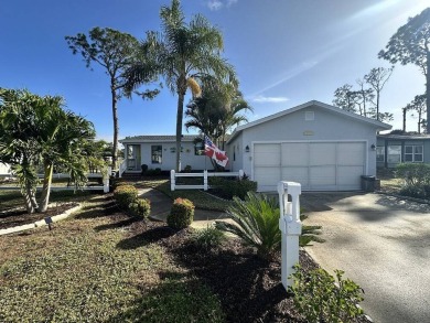 Lot Rent for this home is $1,342.00/monthly. Beautiful stucco on Del Tura Golf and Country Club in Florida - for sale on GolfHomes.com, golf home, golf lot