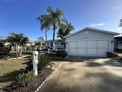 Lot Rent for this home is $1,342.00/monthly. Beautiful stucco on Del Tura Golf and Country Club in Florida - for sale on GolfHomes.com, golf home, golf lot