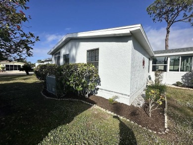 Lot Rent for this home is $1,342.00/monthly. Beautiful stucco on Del Tura Golf and Country Club in Florida - for sale on GolfHomes.com, golf home, golf lot