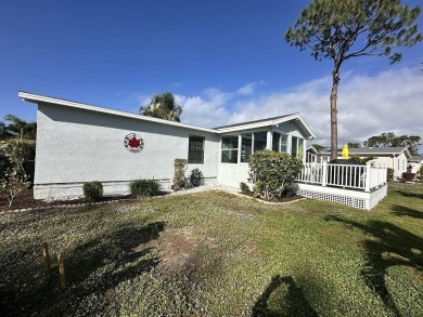 Lot Rent for this home is $1,342.00/monthly. Beautiful stucco on Del Tura Golf and Country Club in Florida - for sale on GolfHomes.com, golf home, golf lot