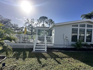 Lot Rent for this home is $1,342.00/monthly. Beautiful stucco on Del Tura Golf and Country Club in Florida - for sale on GolfHomes.com, golf home, golf lot