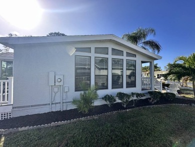 Lot Rent for this home is $1,342.00/monthly. Beautiful stucco on Del Tura Golf and Country Club in Florida - for sale on GolfHomes.com, golf home, golf lot