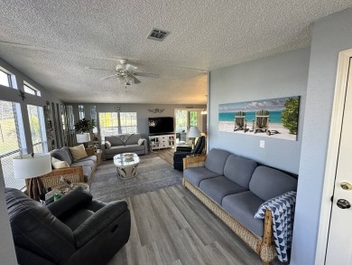 Lot Rent for this home is $1,342.00/monthly. Beautiful stucco on Del Tura Golf and Country Club in Florida - for sale on GolfHomes.com, golf home, golf lot