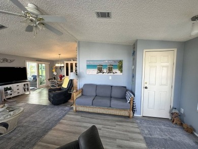 Lot Rent for this home is $1,342.00/monthly. Beautiful stucco on Del Tura Golf and Country Club in Florida - for sale on GolfHomes.com, golf home, golf lot