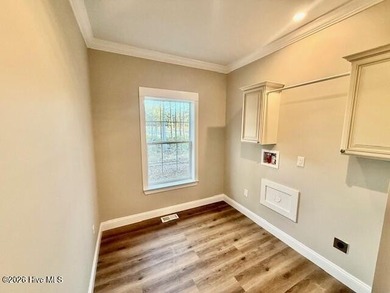 A stunning new construction ranch style home located right on on Minnesott Golf and Country Club in North Carolina - for sale on GolfHomes.com, golf home, golf lot