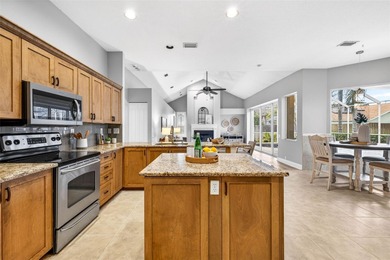 Situated on a rare 10,000+ sq ft lot in Westchase, this heated on Westchase Golf Club in Florida - for sale on GolfHomes.com, golf home, golf lot