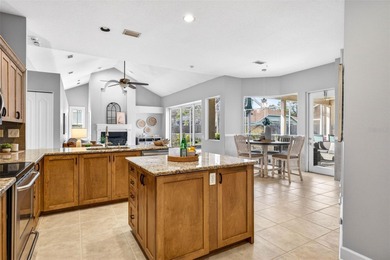 Situated on a rare 10,000+ sq ft lot in Westchase, this heated on Westchase Golf Club in Florida - for sale on GolfHomes.com, golf home, golf lot