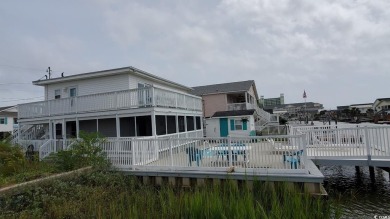 This Charming Multi Family 5 Bedroom,5 bath home nestled on the on Tidewater Golf Club and Plantation in South Carolina - for sale on GolfHomes.com, golf home, golf lot