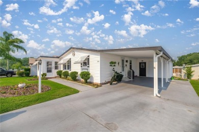 Welcome to this lovely two-bedroom, two-bath home located in the on Orange Blossom Hills Golf and Country Club in Florida - for sale on GolfHomes.com, golf home, golf lot