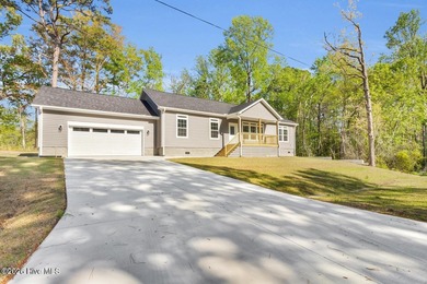 A stunning new construction ranch style home located right on on Minnesott Golf and Country Club in North Carolina - for sale on GolfHomes.com, golf home, golf lot