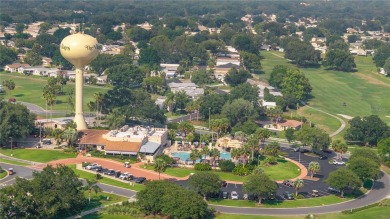 Welcome to this lovely two-bedroom, two-bath home located in the on Orange Blossom Hills Golf and Country Club in Florida - for sale on GolfHomes.com, golf home, golf lot